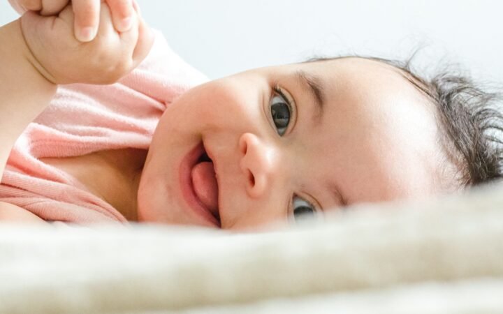 Baby lying on a white sheet