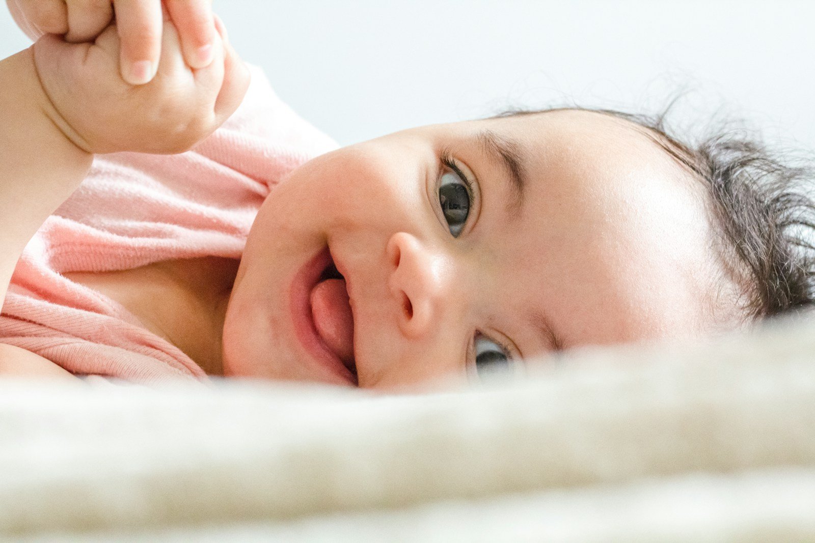 Baby lying on a white sheet