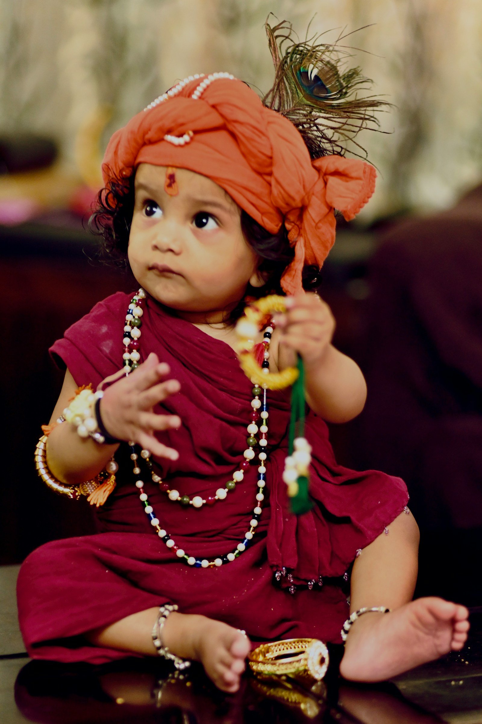 Girl in a red dress with an orange headband