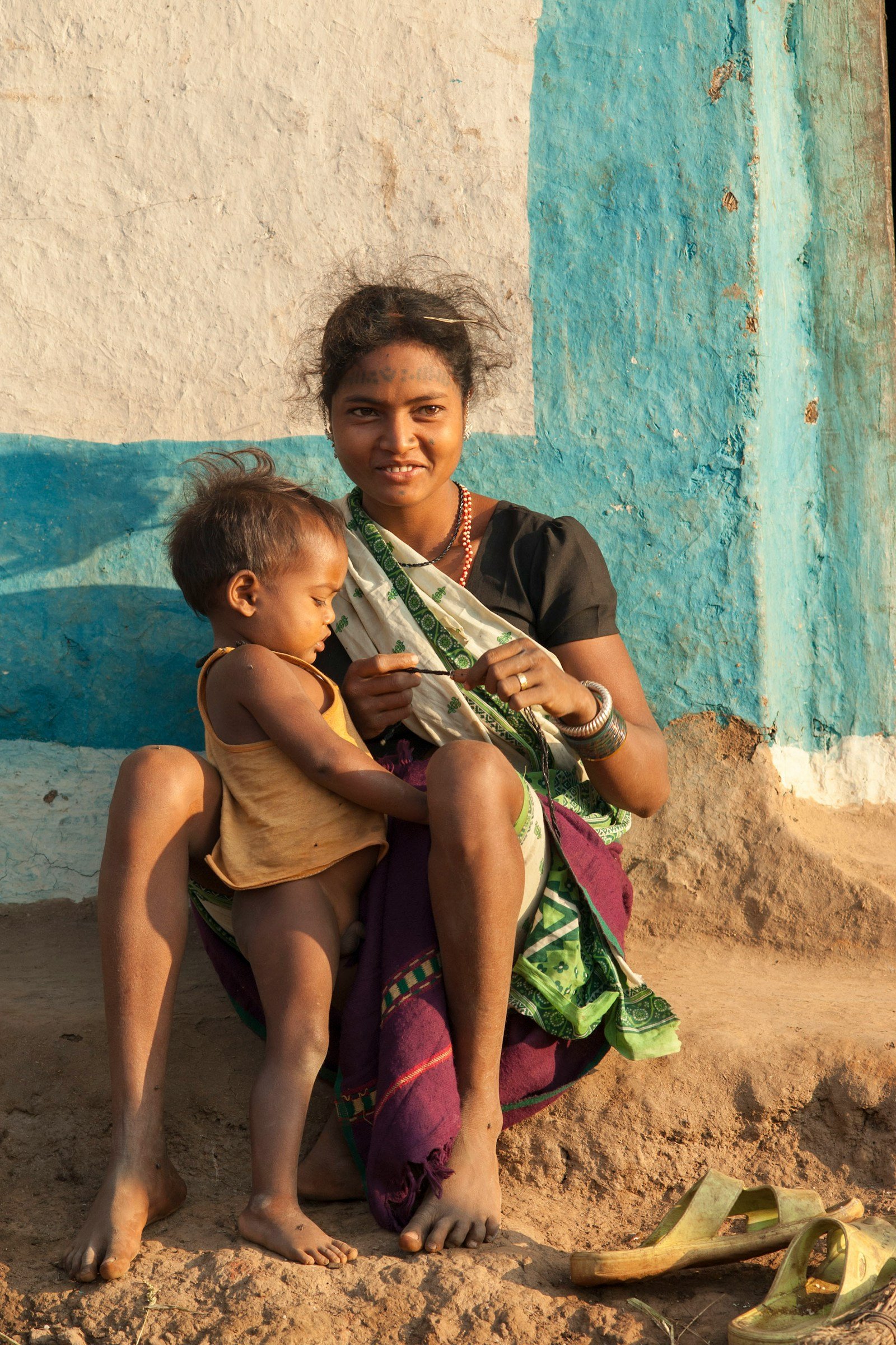Indian mother holding her child