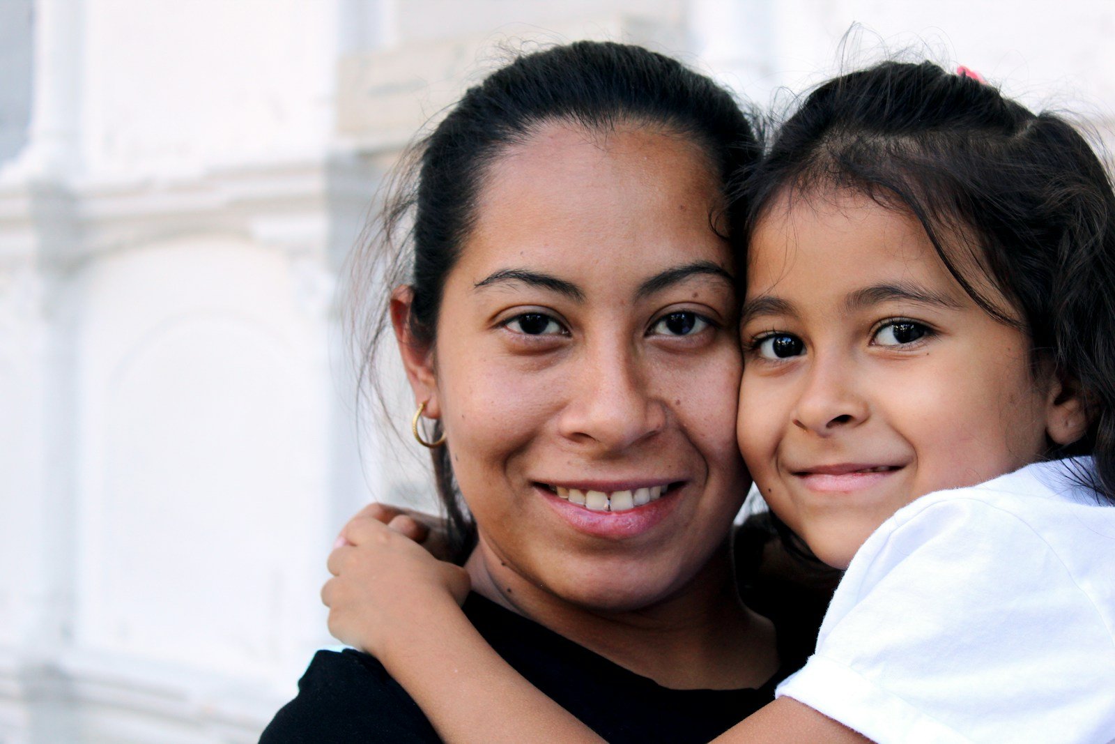 Mother and child smiling together