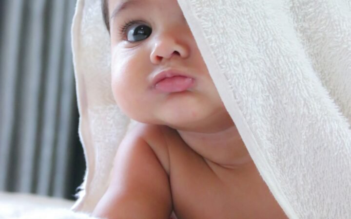 Newborn baby wrapped in a white towel