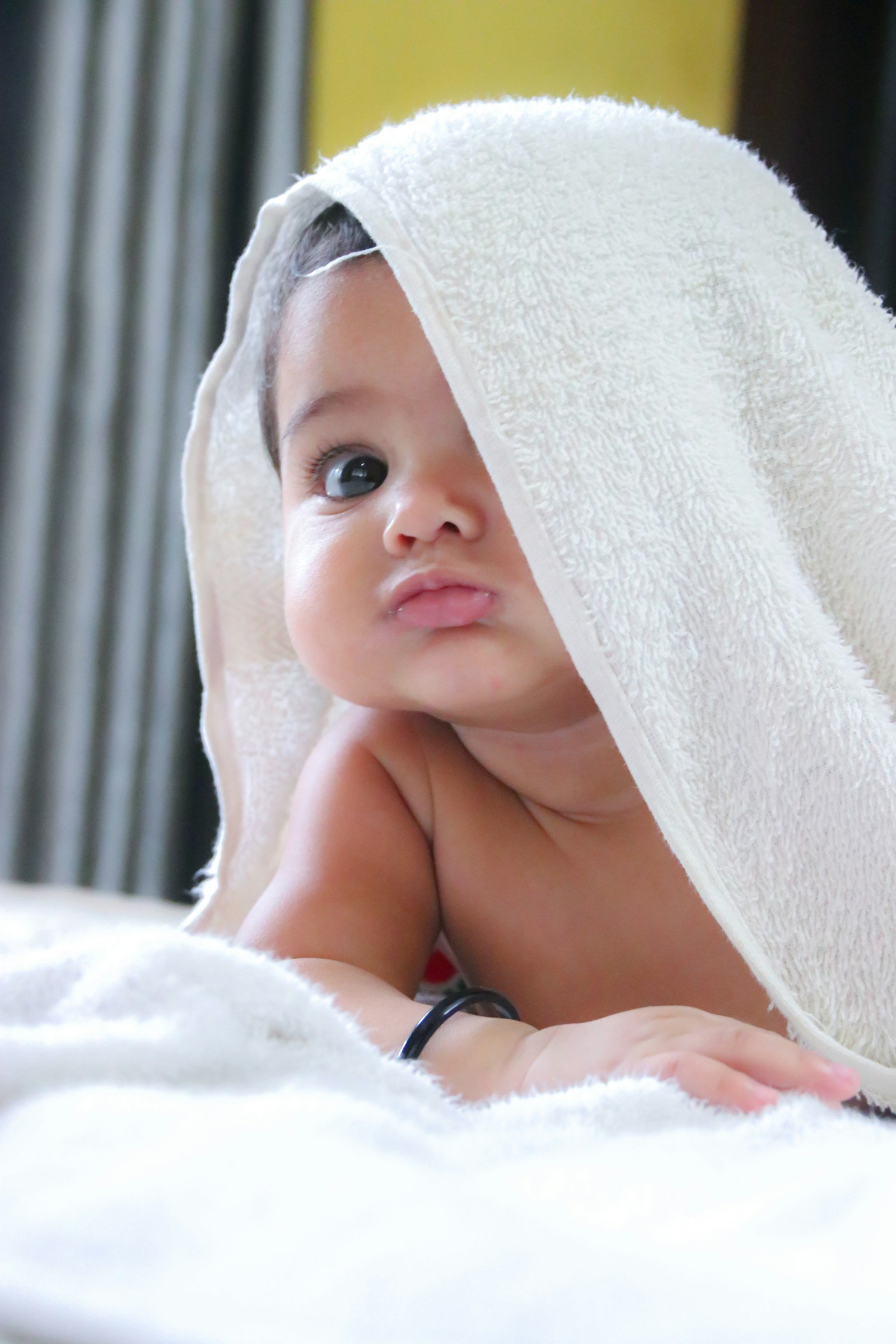 Newborn baby wrapped in a white towel
